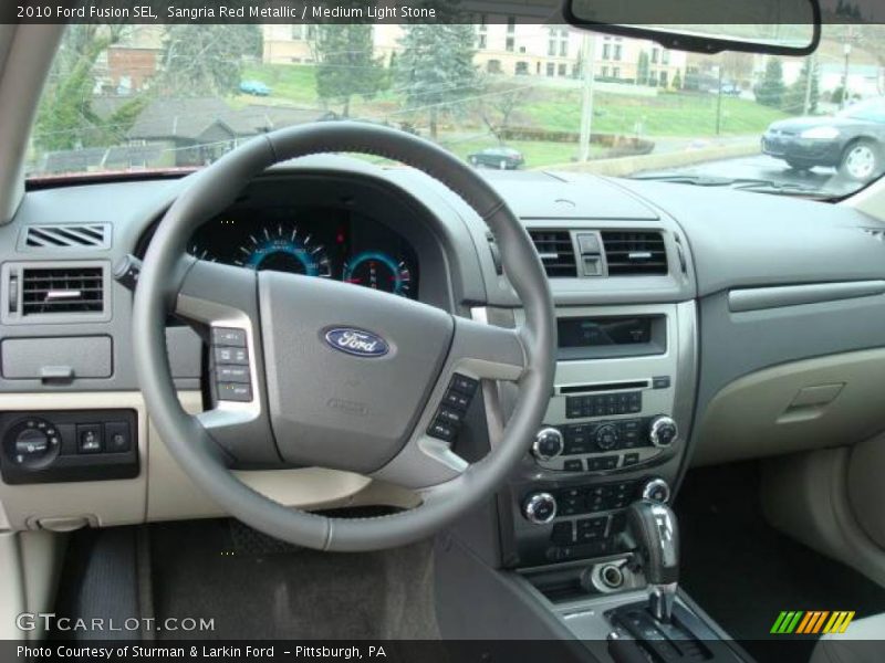 Sangria Red Metallic / Medium Light Stone 2010 Ford Fusion SEL