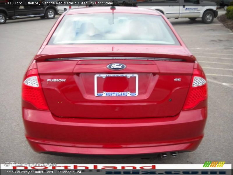 Sangria Red Metallic / Medium Light Stone 2010 Ford Fusion SE