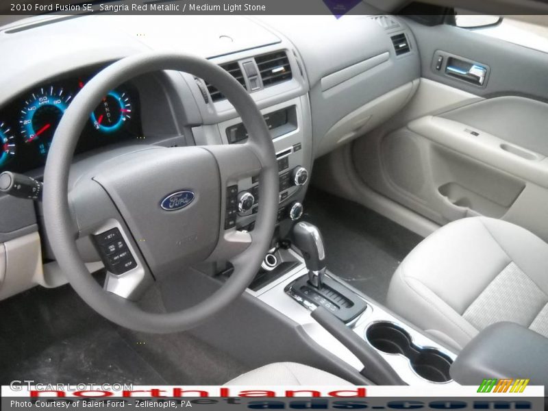 Sangria Red Metallic / Medium Light Stone 2010 Ford Fusion SE