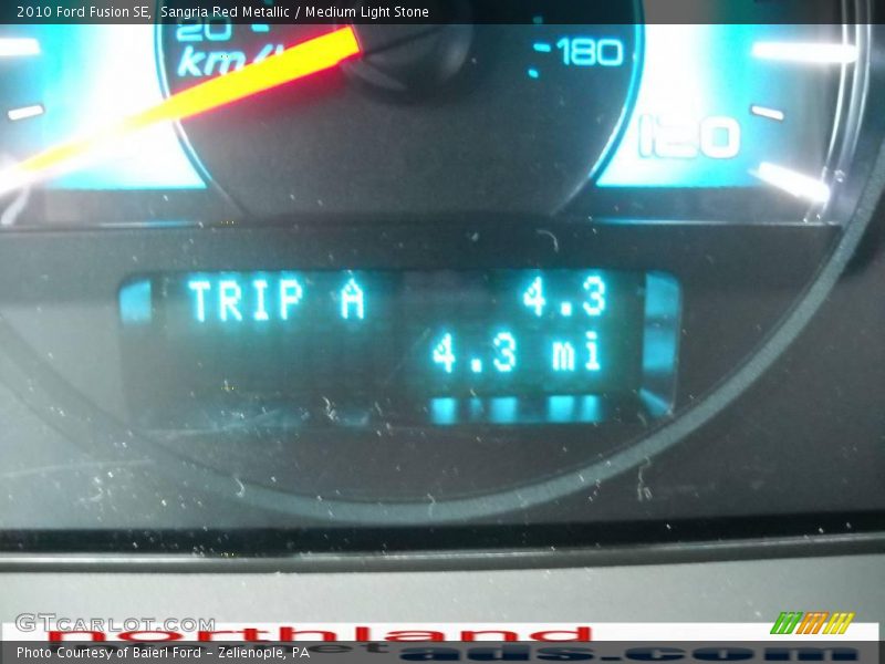 Sangria Red Metallic / Medium Light Stone 2010 Ford Fusion SE