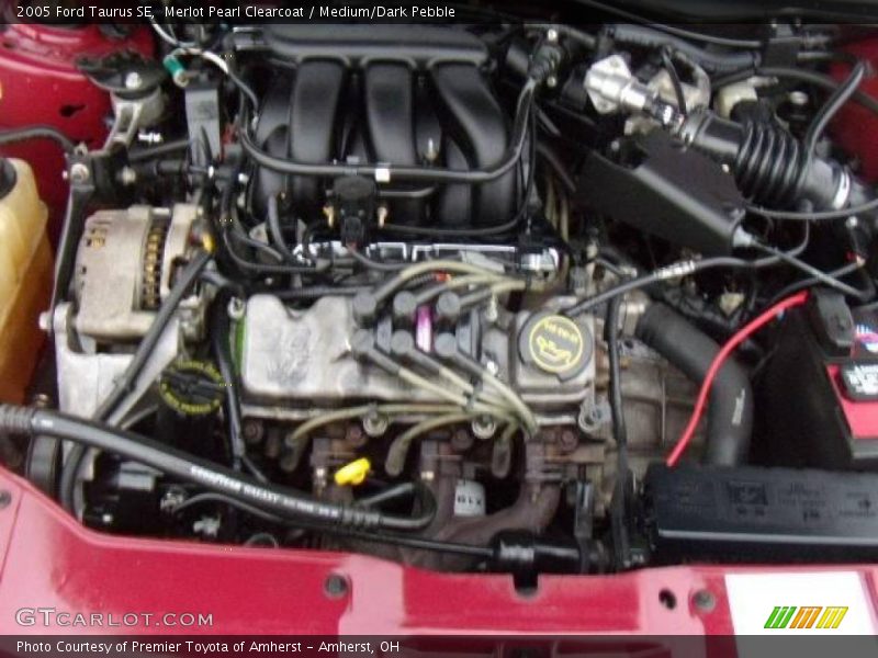 Merlot Pearl Clearcoat / Medium/Dark Pebble 2005 Ford Taurus SE