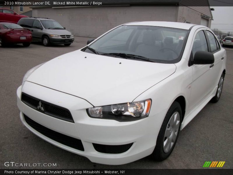 Wicked White Metallic / Beige 2010 Mitsubishi Lancer DE