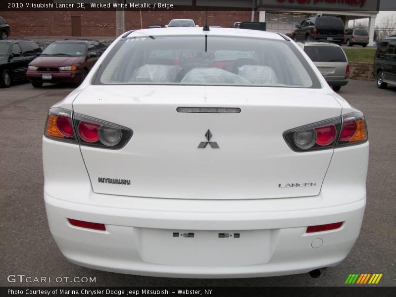 Wicked White Metallic / Beige 2010 Mitsubishi Lancer DE