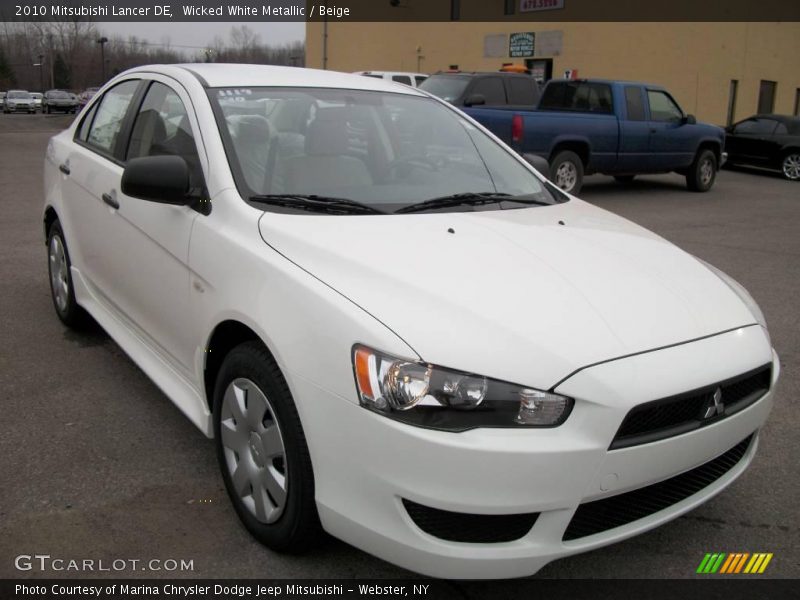 Wicked White Metallic / Beige 2010 Mitsubishi Lancer DE