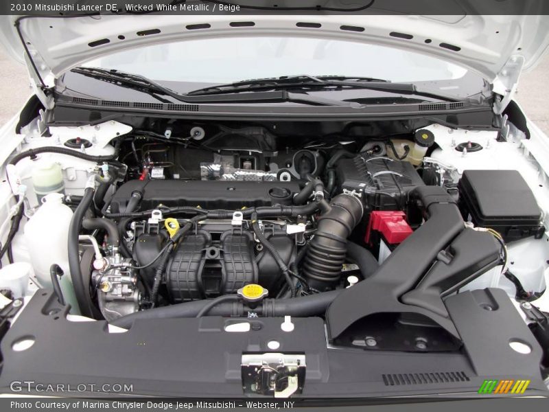Wicked White Metallic / Beige 2010 Mitsubishi Lancer DE