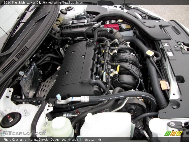 Wicked White Metallic / Beige 2010 Mitsubishi Lancer DE