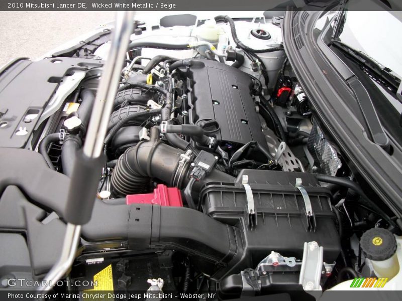 Wicked White Metallic / Beige 2010 Mitsubishi Lancer DE