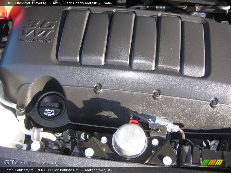 Dark Cherry Metallic / Ebony 2009 Chevrolet Traverse LT AWD
