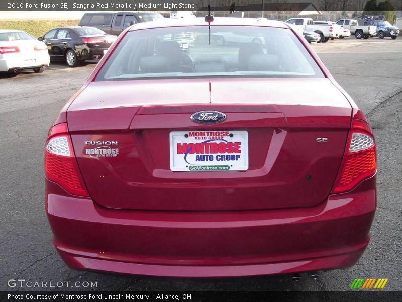 Sangria Red Metallic / Medium Light Stone 2010 Ford Fusion SE