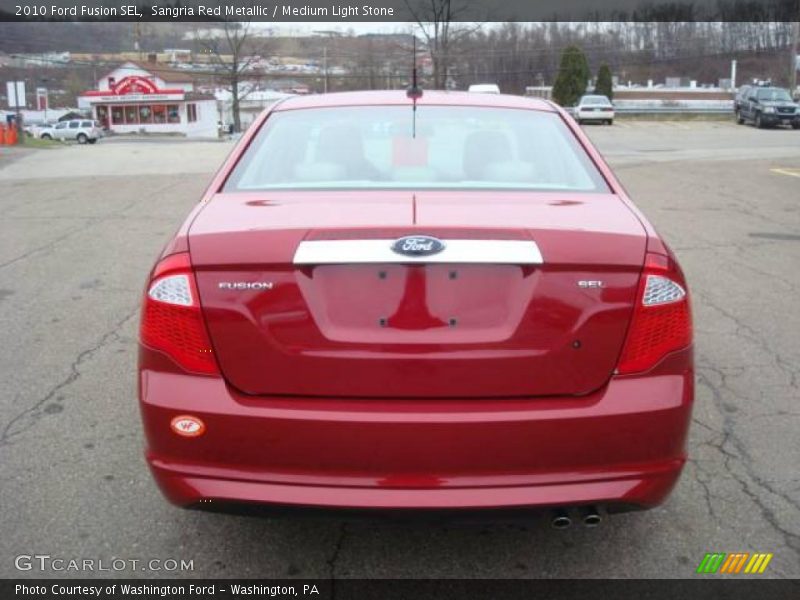 Sangria Red Metallic / Medium Light Stone 2010 Ford Fusion SEL