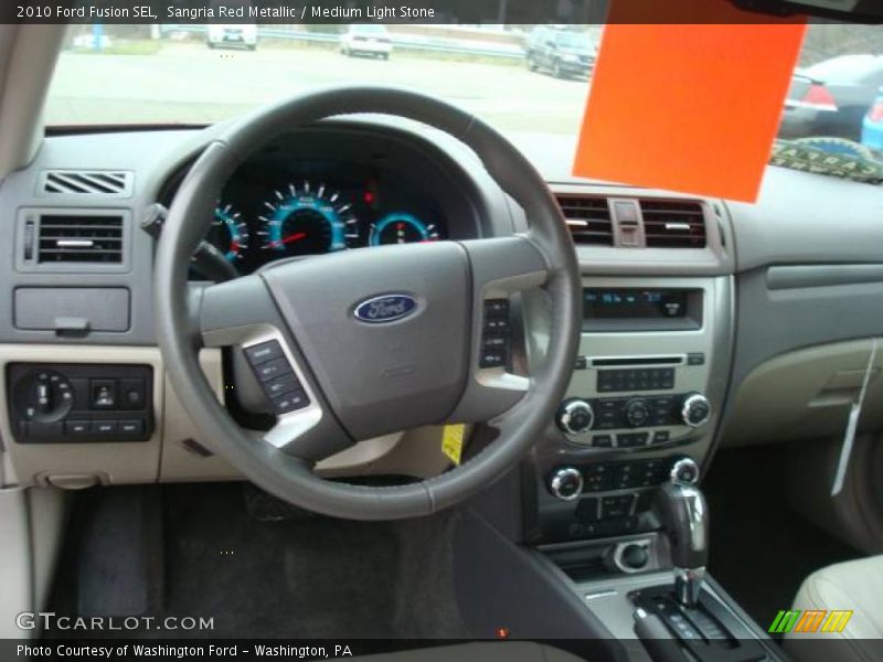 Sangria Red Metallic / Medium Light Stone 2010 Ford Fusion SEL