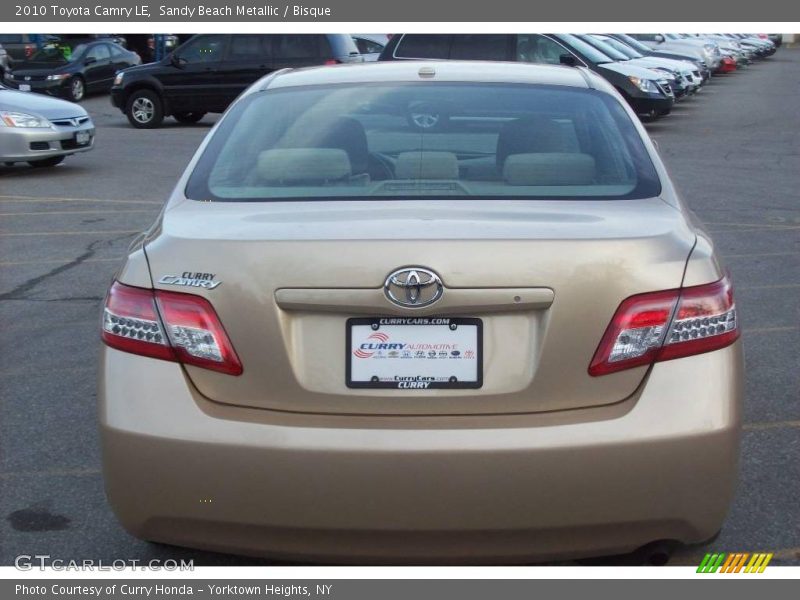 Sandy Beach Metallic / Bisque 2010 Toyota Camry LE
