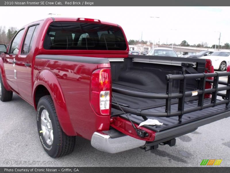 Red Brick / Beige 2010 Nissan Frontier SE Crew Cab