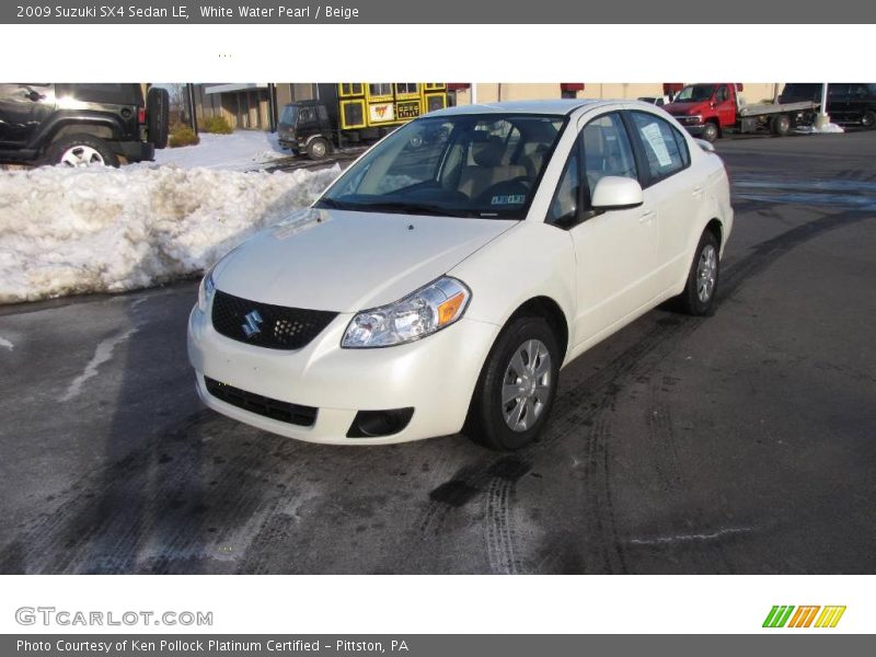 White Water Pearl / Beige 2009 Suzuki SX4 Sedan LE