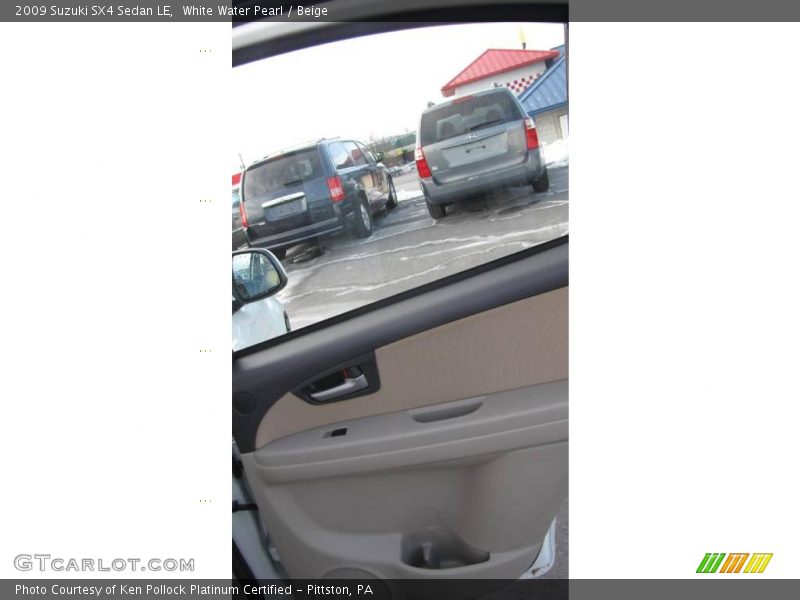 White Water Pearl / Beige 2009 Suzuki SX4 Sedan LE