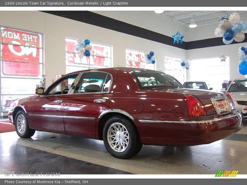 Cordovan Metallic / Light Graphite 1999 Lincoln Town Car Signature