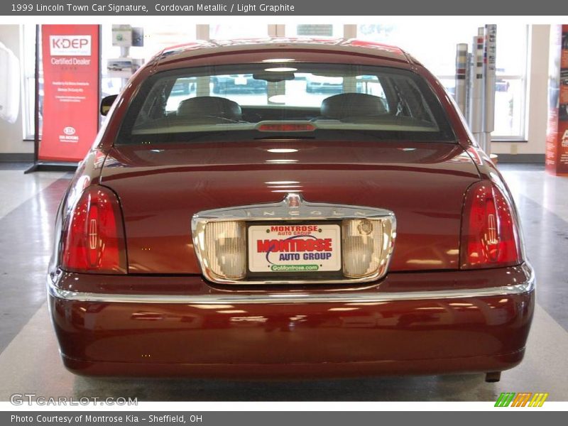 Cordovan Metallic / Light Graphite 1999 Lincoln Town Car Signature