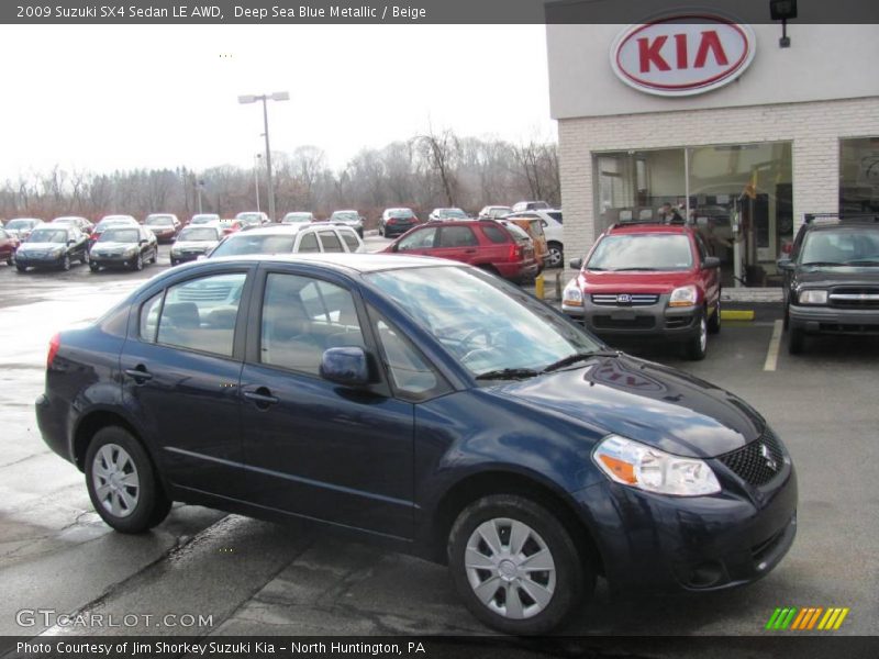 Deep Sea Blue Metallic / Beige 2009 Suzuki SX4 Sedan LE AWD