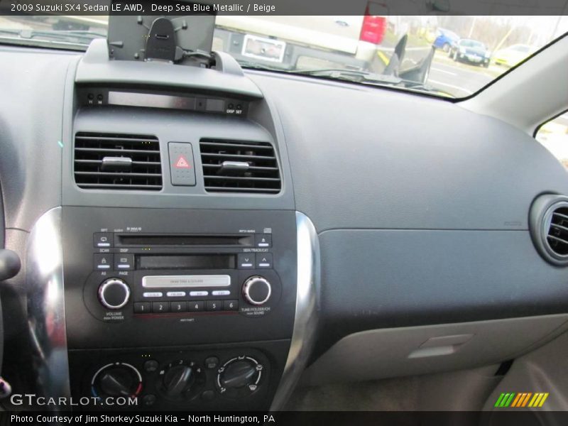 Deep Sea Blue Metallic / Beige 2009 Suzuki SX4 Sedan LE AWD