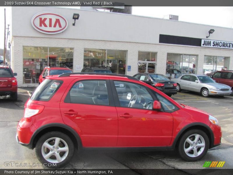 Vivid Red / Black 2009 Suzuki SX4 Crossover Technology AWD