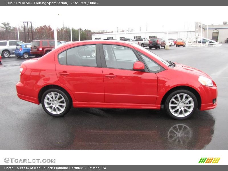 Vivid Red / Black 2009 Suzuki SX4 Touring Sport Sedan