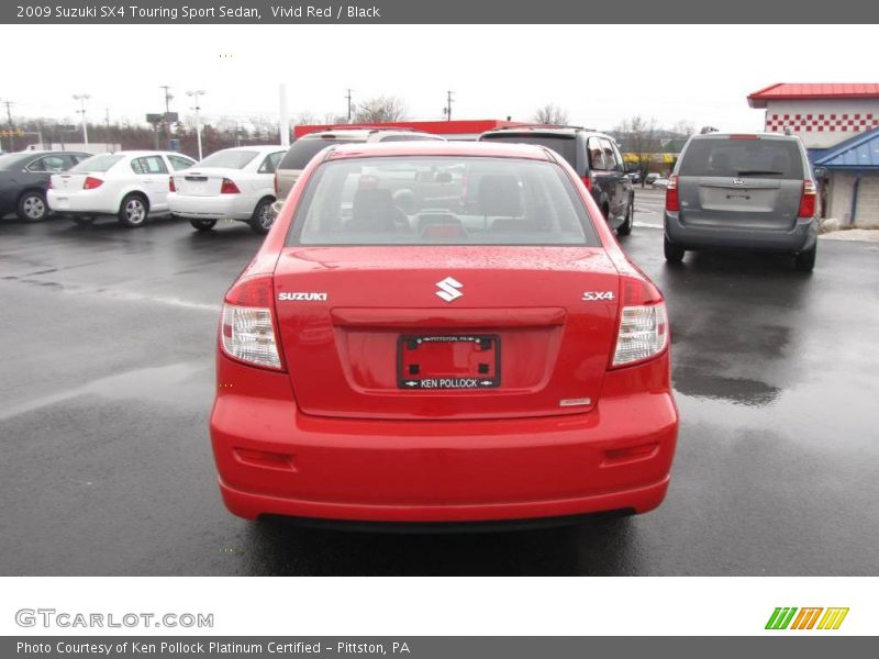Vivid Red / Black 2009 Suzuki SX4 Touring Sport Sedan