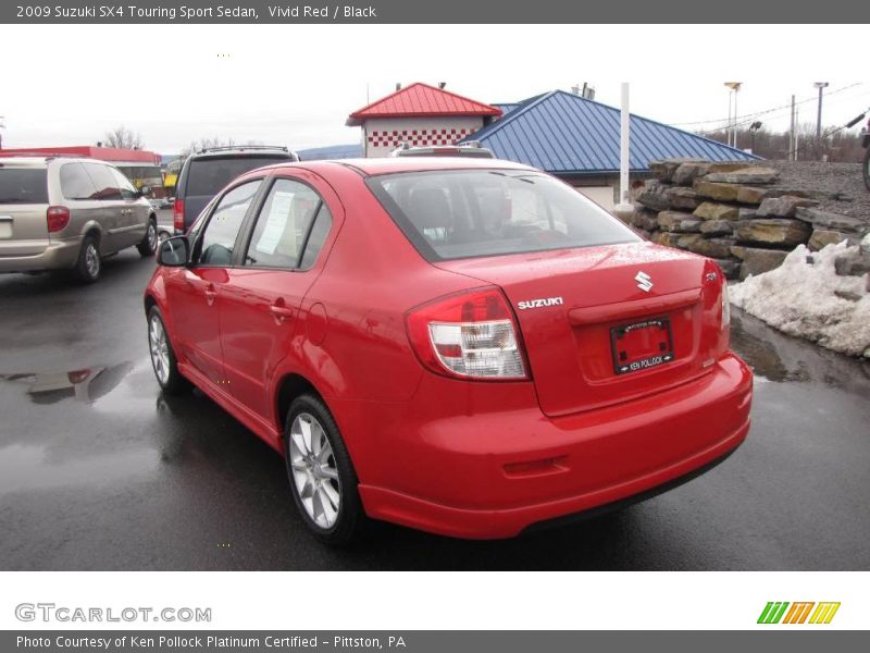 Vivid Red / Black 2009 Suzuki SX4 Touring Sport Sedan