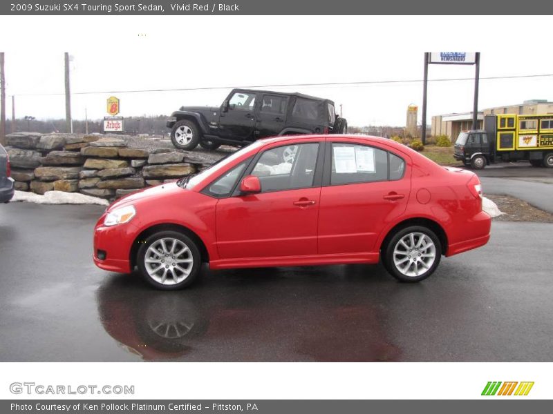Vivid Red / Black 2009 Suzuki SX4 Touring Sport Sedan