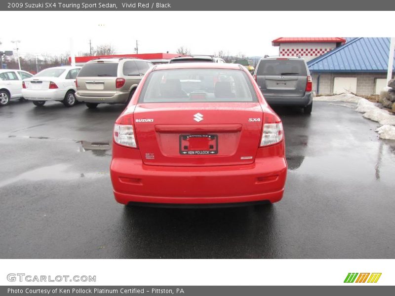 Vivid Red / Black 2009 Suzuki SX4 Touring Sport Sedan