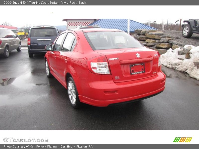Vivid Red / Black 2009 Suzuki SX4 Touring Sport Sedan