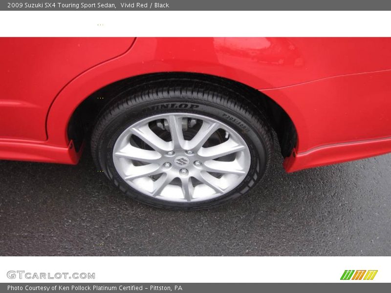 Vivid Red / Black 2009 Suzuki SX4 Touring Sport Sedan