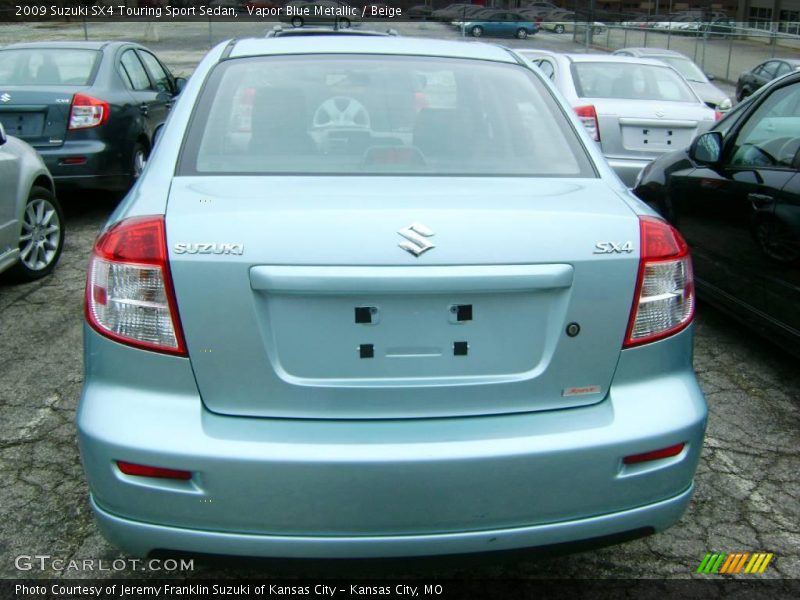 Vapor Blue Metallic / Beige 2009 Suzuki SX4 Touring Sport Sedan