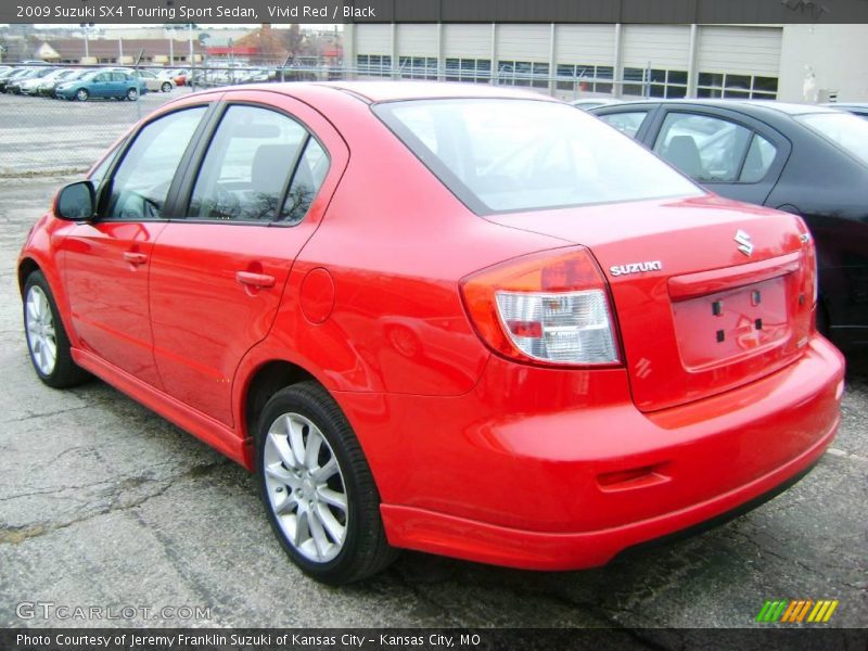 Vivid Red / Black 2009 Suzuki SX4 Touring Sport Sedan