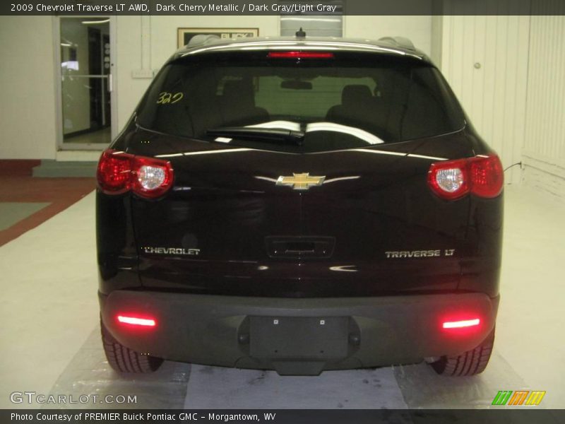 Dark Cherry Metallic / Dark Gray/Light Gray 2009 Chevrolet Traverse LT AWD