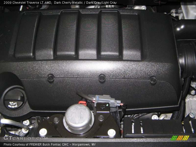Dark Cherry Metallic / Dark Gray/Light Gray 2009 Chevrolet Traverse LT AWD