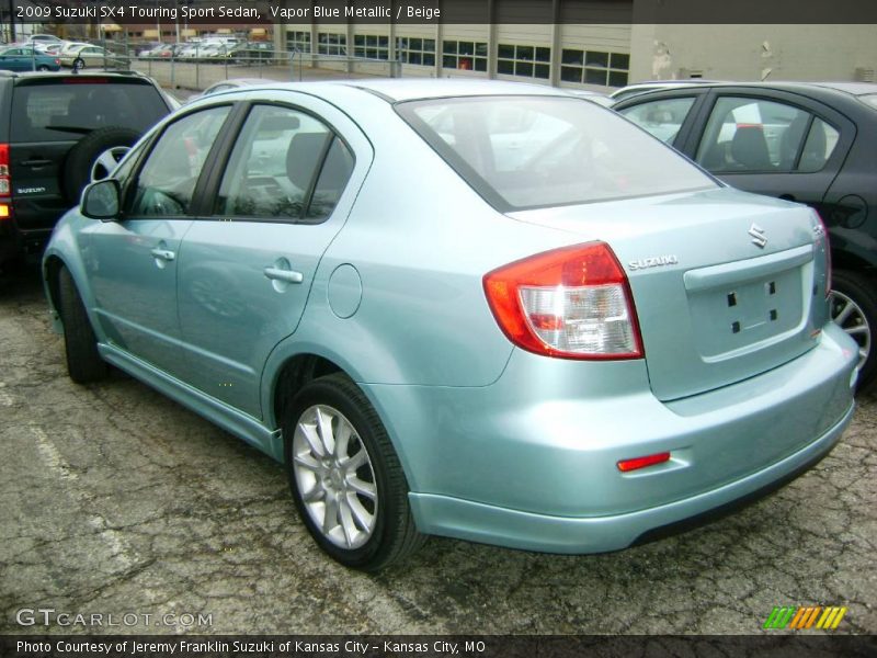 Vapor Blue Metallic / Beige 2009 Suzuki SX4 Touring Sport Sedan