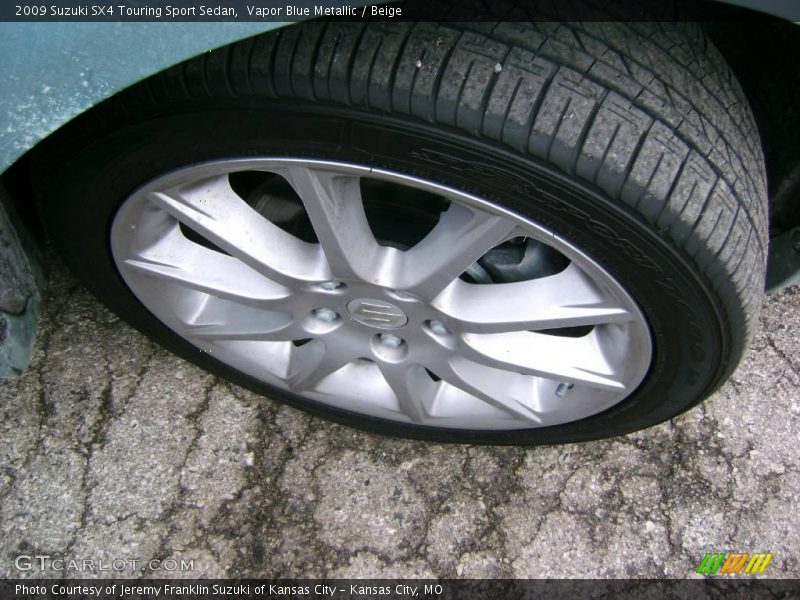 Vapor Blue Metallic / Beige 2009 Suzuki SX4 Touring Sport Sedan