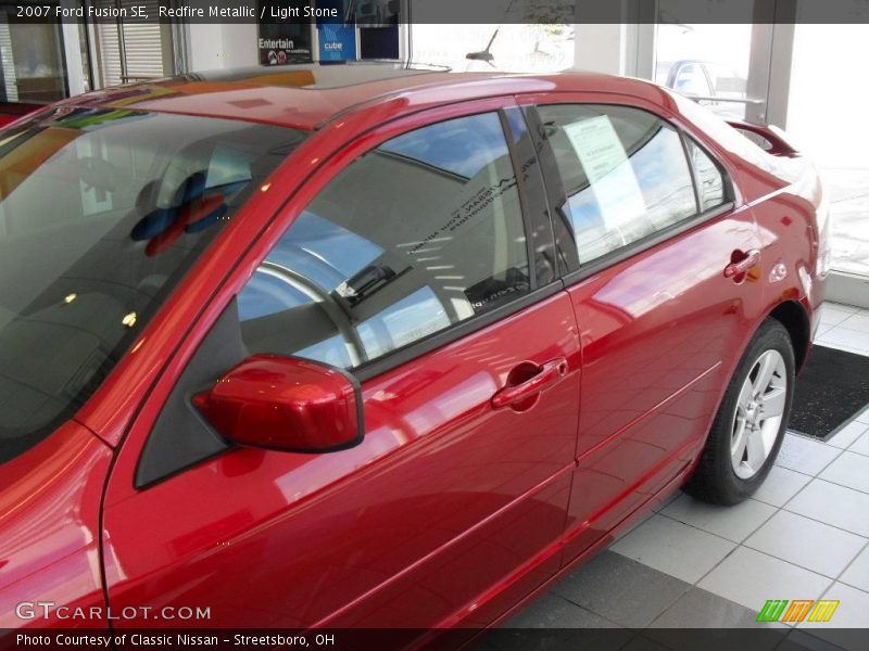 Redfire Metallic / Light Stone 2007 Ford Fusion SE