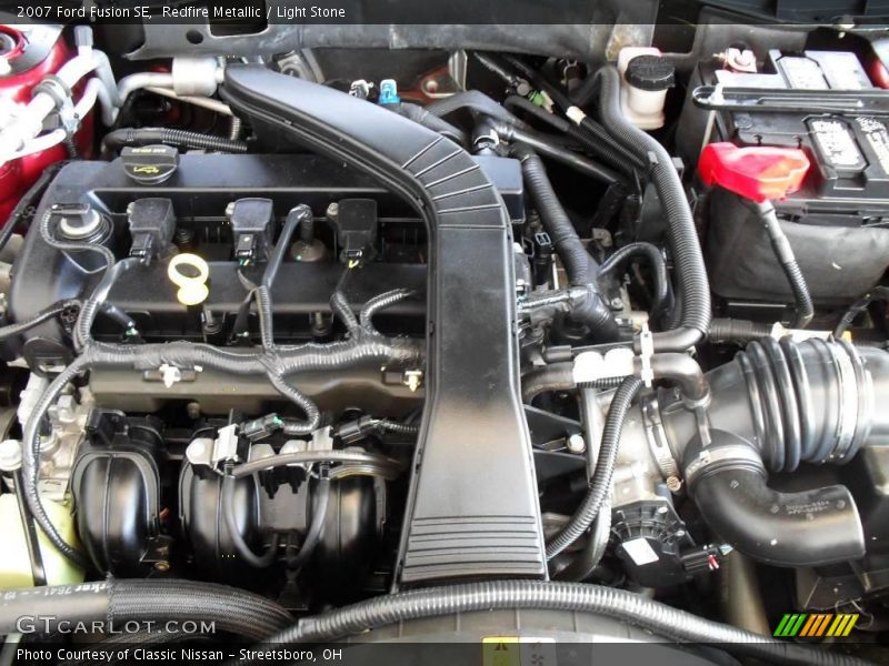 Redfire Metallic / Light Stone 2007 Ford Fusion SE