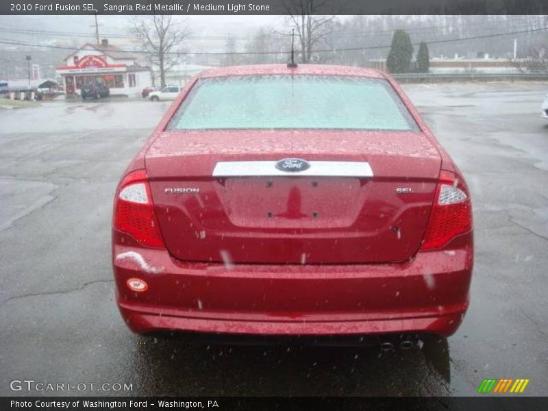 Sangria Red Metallic / Medium Light Stone 2010 Ford Fusion SEL