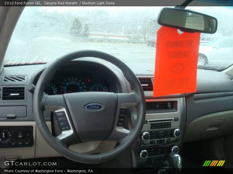 Sangria Red Metallic / Medium Light Stone 2010 Ford Fusion SEL