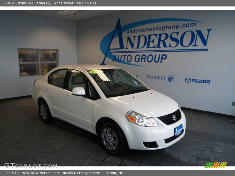White Water Pearl / Beige 2009 Suzuki SX4 Sedan LE