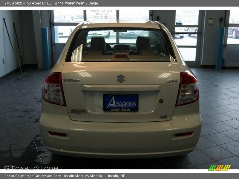 White Water Pearl / Beige 2009 Suzuki SX4 Sedan LE