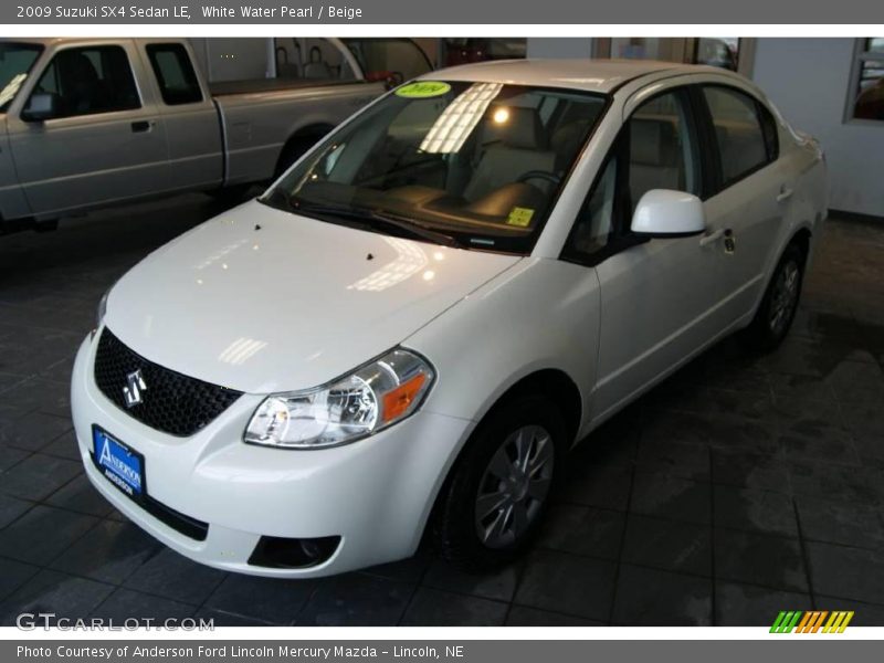 White Water Pearl / Beige 2009 Suzuki SX4 Sedan LE