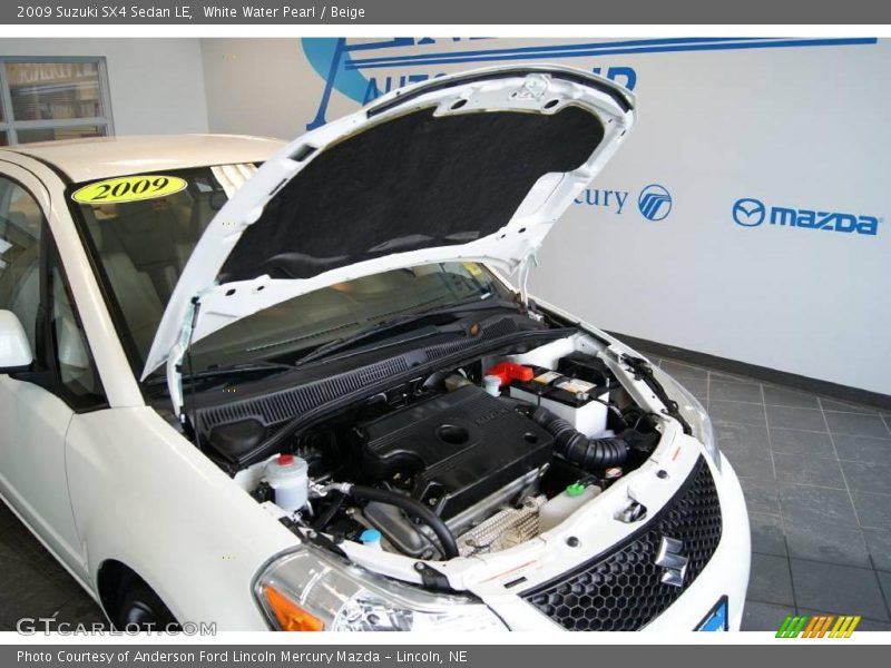 White Water Pearl / Beige 2009 Suzuki SX4 Sedan LE