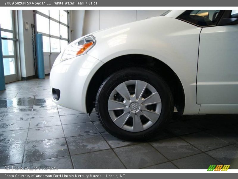 White Water Pearl / Beige 2009 Suzuki SX4 Sedan LE