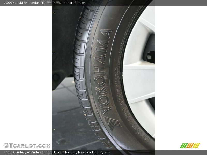 White Water Pearl / Beige 2009 Suzuki SX4 Sedan LE