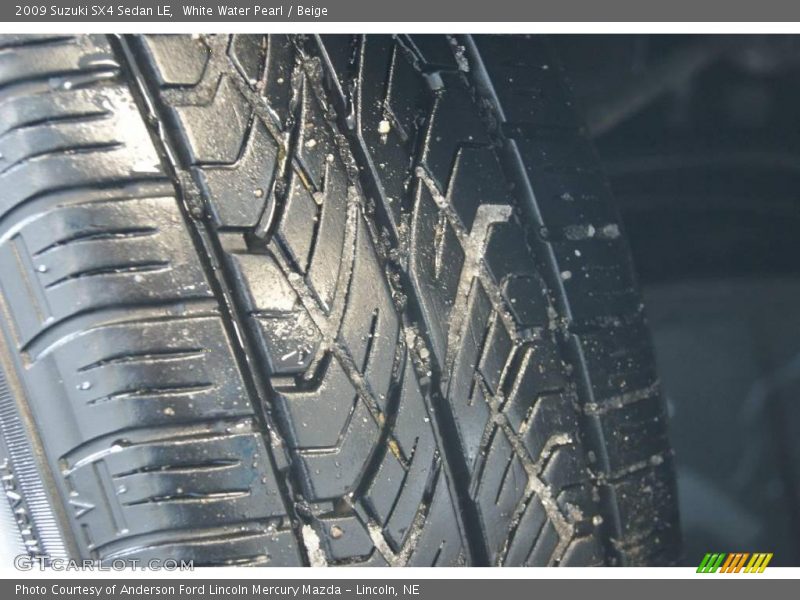 White Water Pearl / Beige 2009 Suzuki SX4 Sedan LE