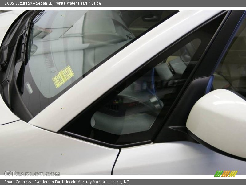 White Water Pearl / Beige 2009 Suzuki SX4 Sedan LE