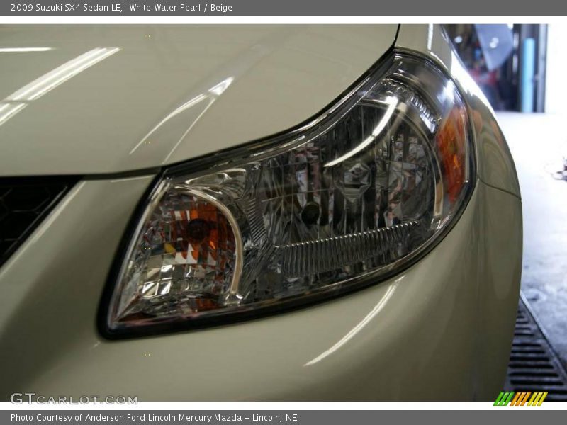 White Water Pearl / Beige 2009 Suzuki SX4 Sedan LE